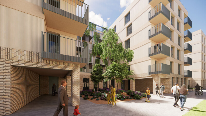 Wohnhof im StadtQuartier Obertürkheim mit Balkonen, Bepflanzung und Sitzbereich zwischen den Gebäuden